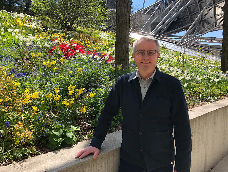 Scott Stewart beside a newly planted garden at the rear of the Jay Pritzker Pavilion