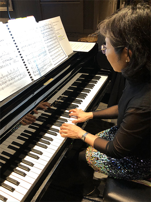 Amy Boonstra at the piano at the Festival's annual meeting