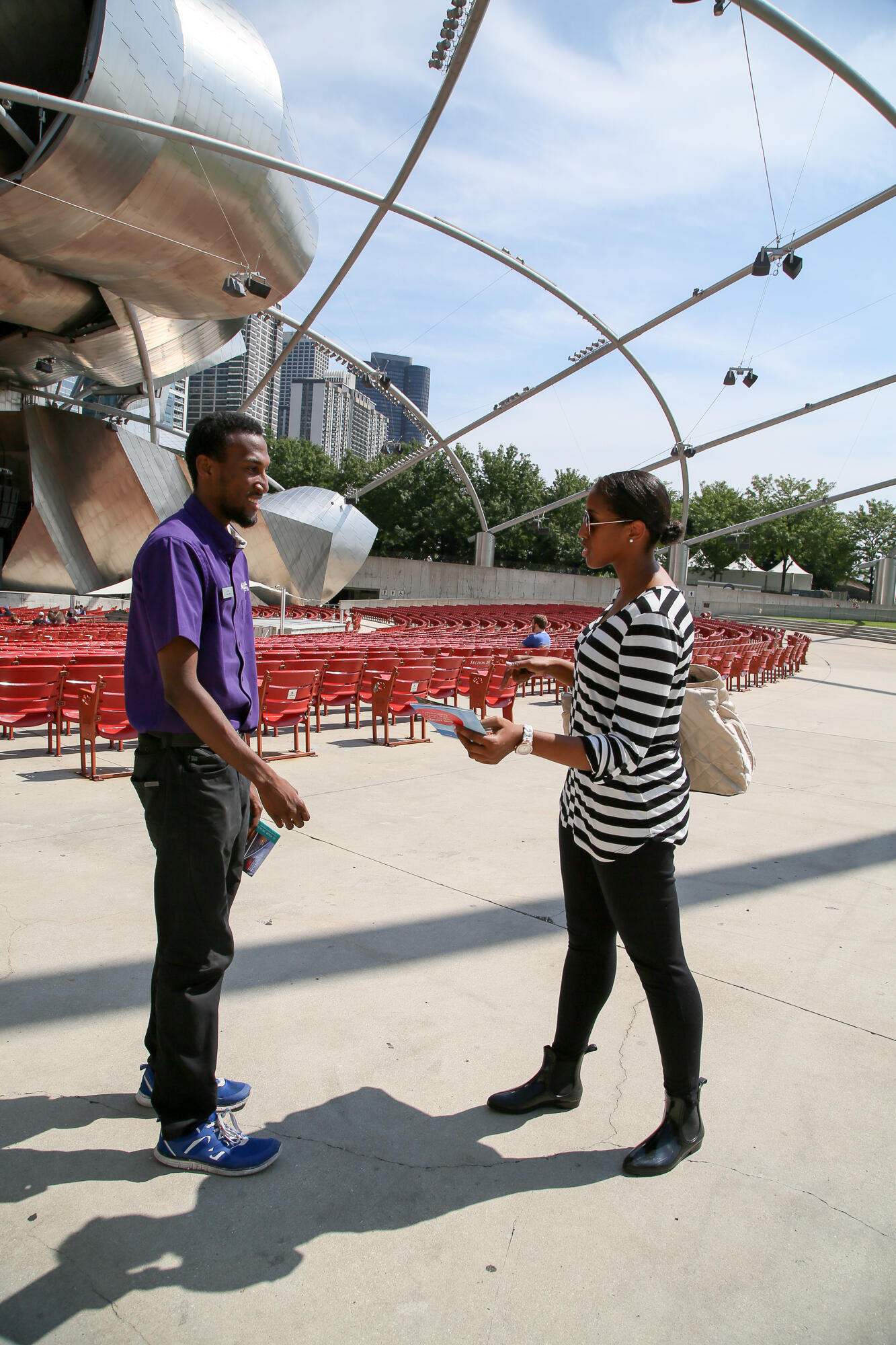 Festival usher John Pope greets Park visitors during an open rehearsal in 2018