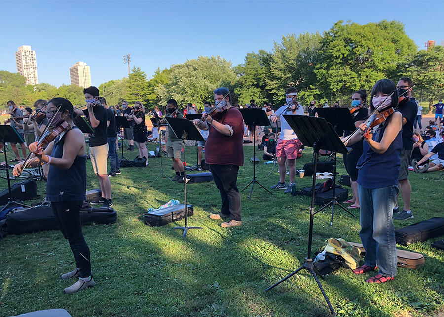 Grant Park Orchestra violinist Rika Seko (right) joins string players from across Chicago for the Elijah McClain vigil