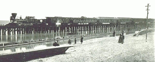 The funeral train of President Abraham Lincoln crosses the trestle east of Michigan Avenue in Chicago (1865).