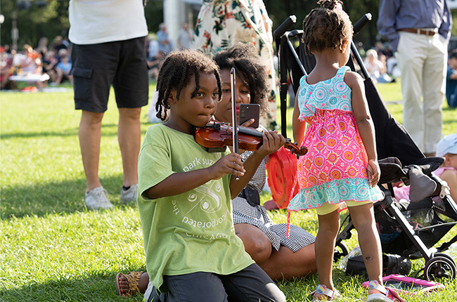 Youngster prepares to play at the Young Artist Showcase